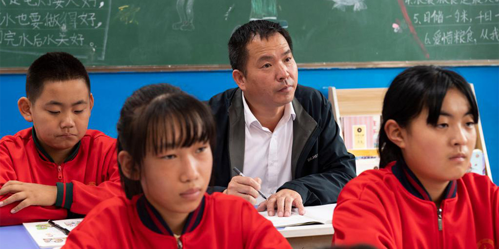 Fotos: diretor da escola central de Beiji no norte da China